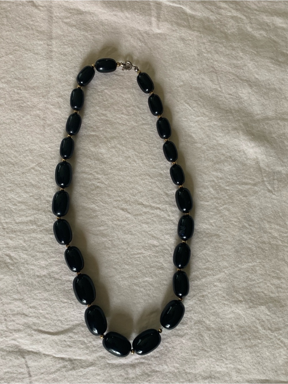 Polished Black Oval Bead Necklace with Gold Accent Spacers